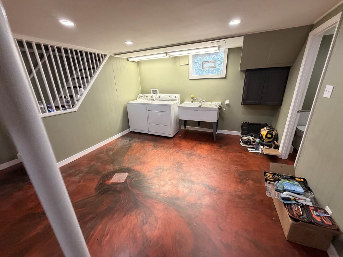 Red and black metallic epoxy basement floor