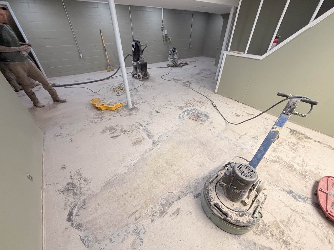 Concrete floor grinding equipment in basement